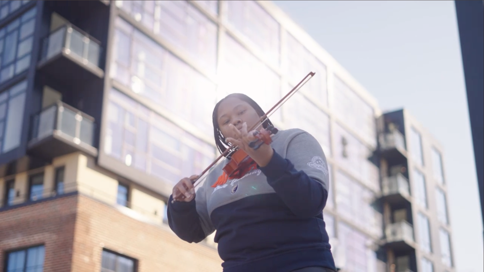 Student playing violin on an HBCU campus