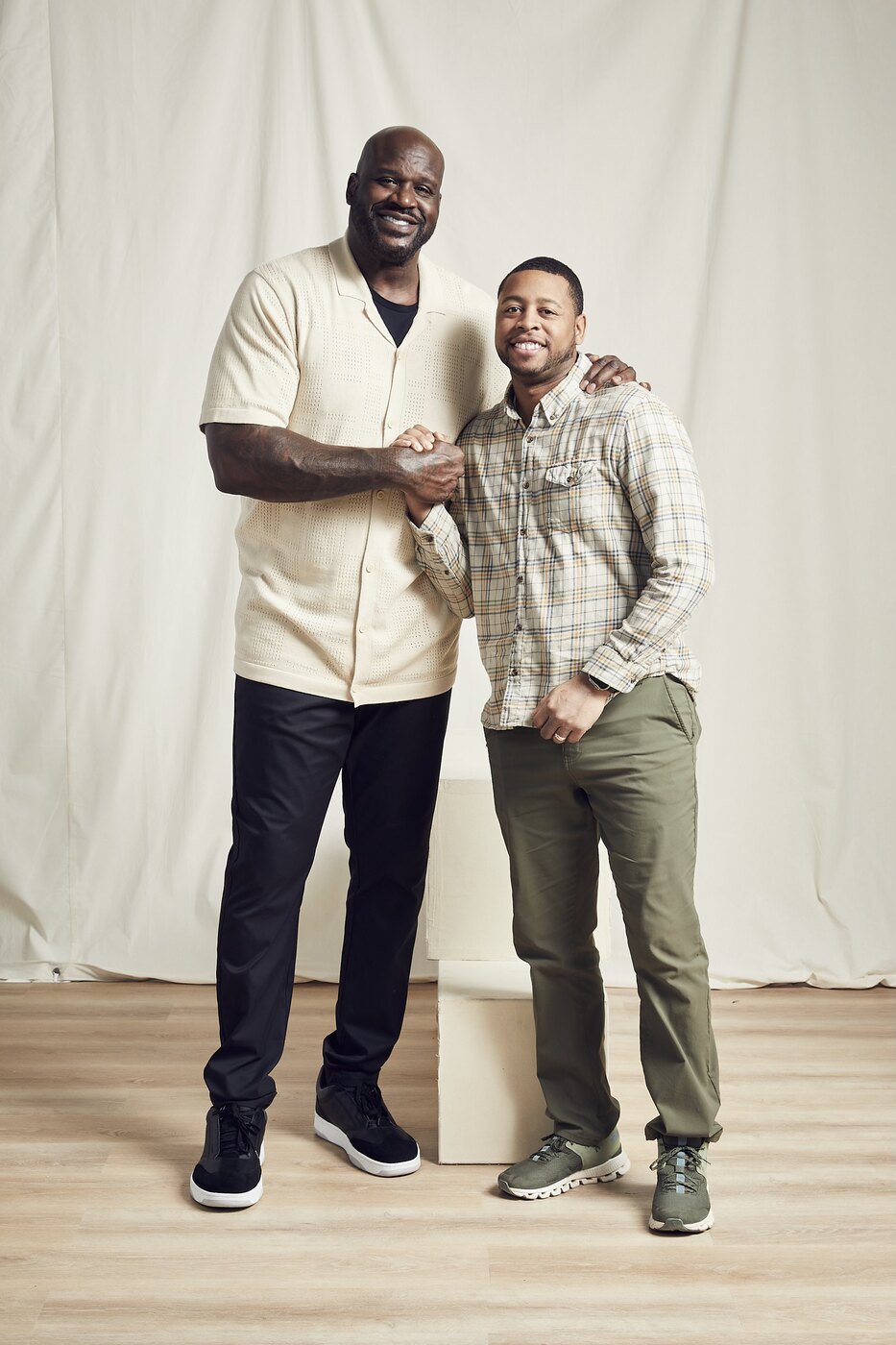 Shaquille O'Neal with a portrait subject on set