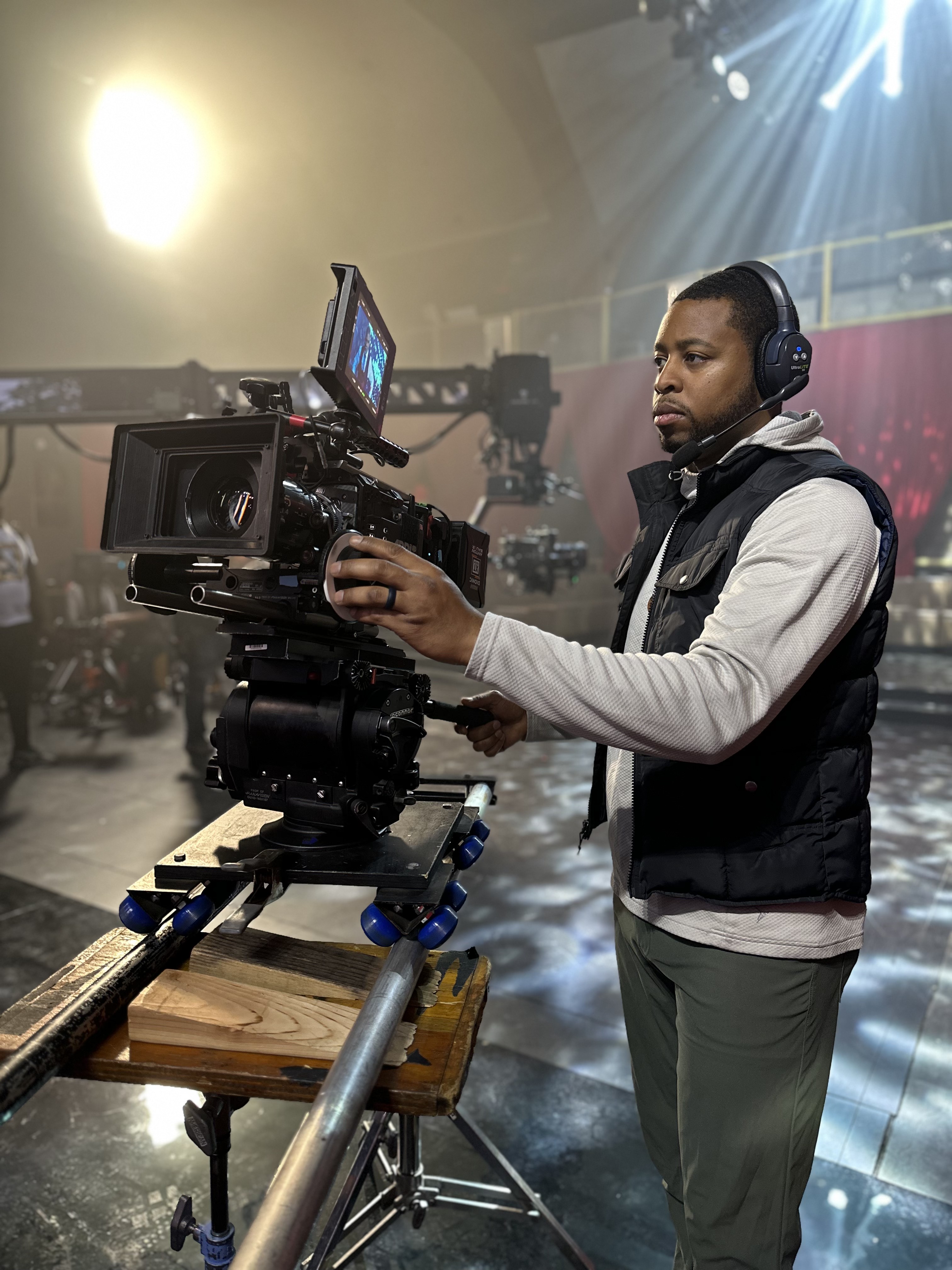 Tim Williams at the cinema camera, holding the follow focus